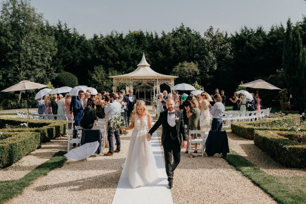 bride and groom outdoor ceremony at manor by the lake